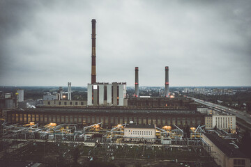 Factory aerial view under dark cloudy sky