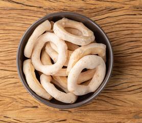 Traditional brazilian polvilho or starch biscuit on a bowl over wooden table