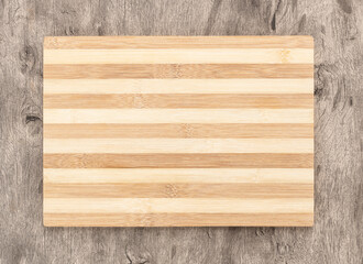 Empty wooden board over wooden table with copy space