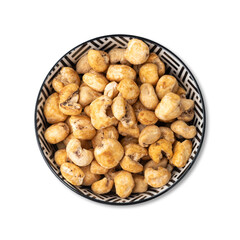 Canjica, hominy or white corn popcorn, sweet popcorn in a bowl isolated over white background