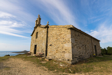 Small and ancient stone hermitage next to the sea