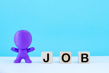 Wooden cubes with word job.