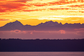 Fototapeta na wymiar Fiery Sunset Over Kitsap Peninsula and Olympic Mountains