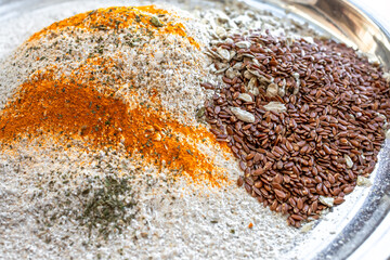 Blend of flour, spices and fiber. Ingredients for diet bread. Rye bread with seeds and basil. Healthy diet. Useful substitute for bread. Cook with whole grain flour. Healthy food.