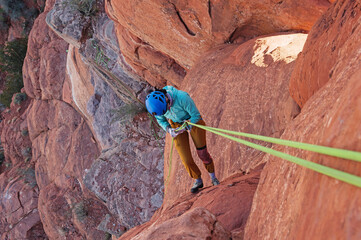 Woman Rappelling from the summit of Bell Rock near Sedona