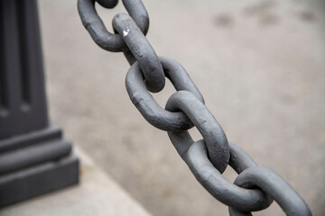 Big street rusty chain on the bridge.