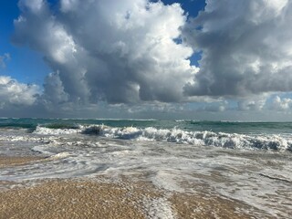 ocean shore against the background of the sky with clouds