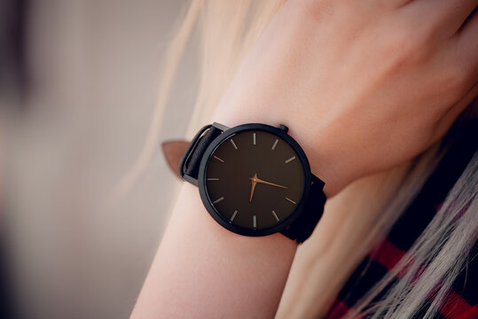 Beautiful Stylish Elegant Classic Black Watch On Woman Hand. Close Up Photo.