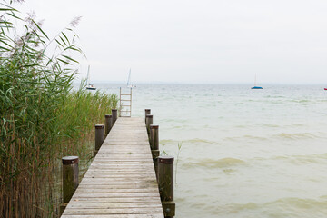 Obraz premium Wooden pier on the banks of the Chiemsee