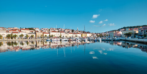Fototapeta na wymiar view of the port of mali losinj with the boat and reflection on the sea surface