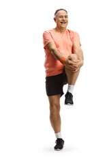 Mature man in sportswear stretching his leg