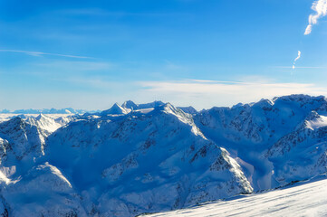 Austrian Alps covered with snow during sunny winter day.