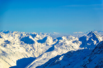 Naklejka premium Austrian Alps covered with snow during sunny winter day.