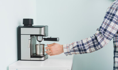 doing fresh coffee at home in the morning using automatic machine