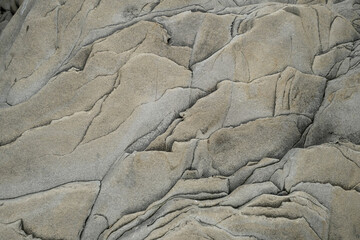 Light gray rough grainy stone texture background. High quality photo