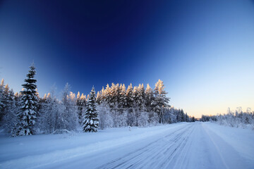 Winter road and blue sky with strong polarization filter effect - 487451886