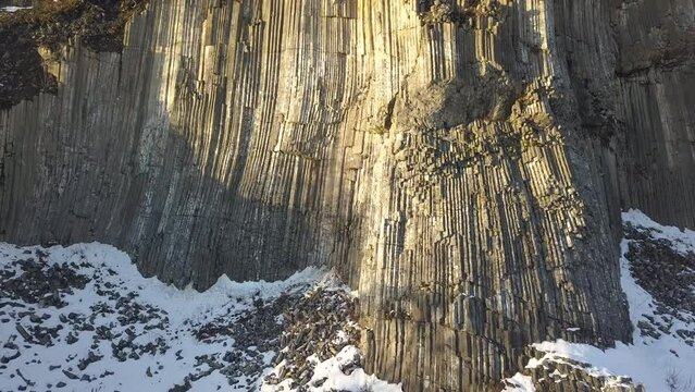 Winter in the Lusatian mountains in the north of the Czech Republic. Basalt rock Zlaty vrch. Volcano rock formation Zlaty vrch built pentagonal and hexagonal basalt columns. 