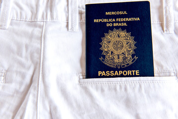 Brazilian pass in white jeans pocket.