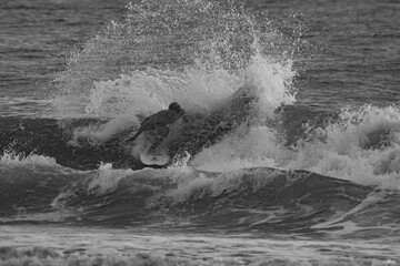 Naklejka premium Surfer in Costa Rica Black and White