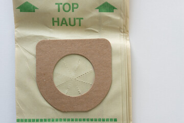 retro green/faded paper vacuum bag with cardboard flange  