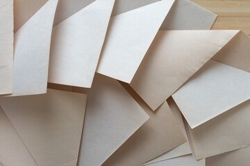 faded pad paper folded into geometric designs on wood