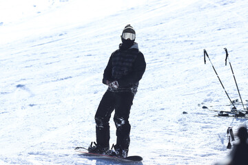 Fototapeta na wymiar a snowboarder skiing at the ski resort