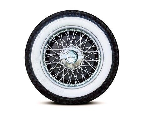 Old Jaguar car spoke wheel isolated
