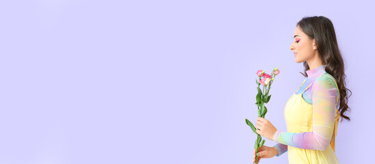 Beautiful woman holding eustoma flowers on color background with space for text. International Women's Day