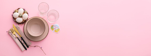 Beautiful table setting for Easter celebration on pink background with space for text