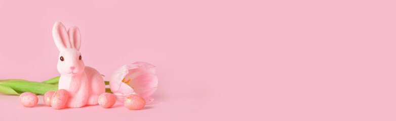 Cute Easter bunny, eggs and flower on pink background with space for text