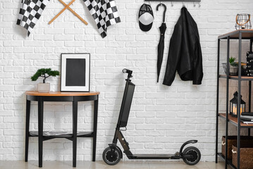 Stylish interior of room with modern electric scooter © Pixel-Shot