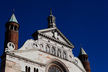 Cremona Cathedral in Cremona, Lombardy is a Catholic church in northern Italy with the white marble statues, the bell tower (Torrazzo) and the seat of the Bishop of Cremona. European architecture.