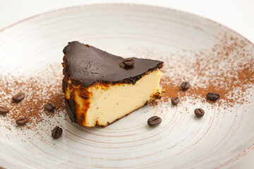 Plate with slice of tasty Basque burnt cheesecake, closeup