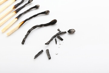 Burnt matches on white background, closeup. Different life stages concept