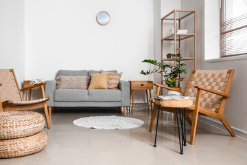 Interior of modern living room with sofa and wooden armchairs
