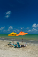 Beach. Sao Miguel dos Milagres, Alagoas, Brazil. Colorful umbrellas and chairs at Toque Beach on February 11, 2022.