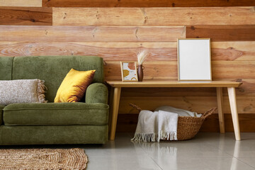 Interior of modern living room with green sofa and coffee table