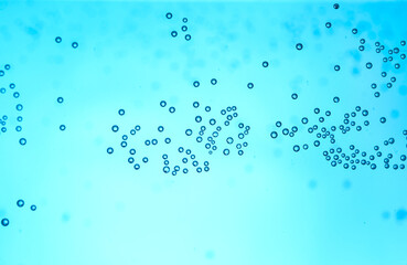 Clear water with air bubbles on blue background