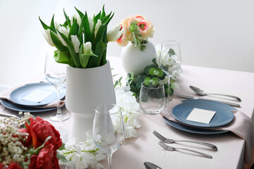 Stylish table setting with beautiful tulip flowers
