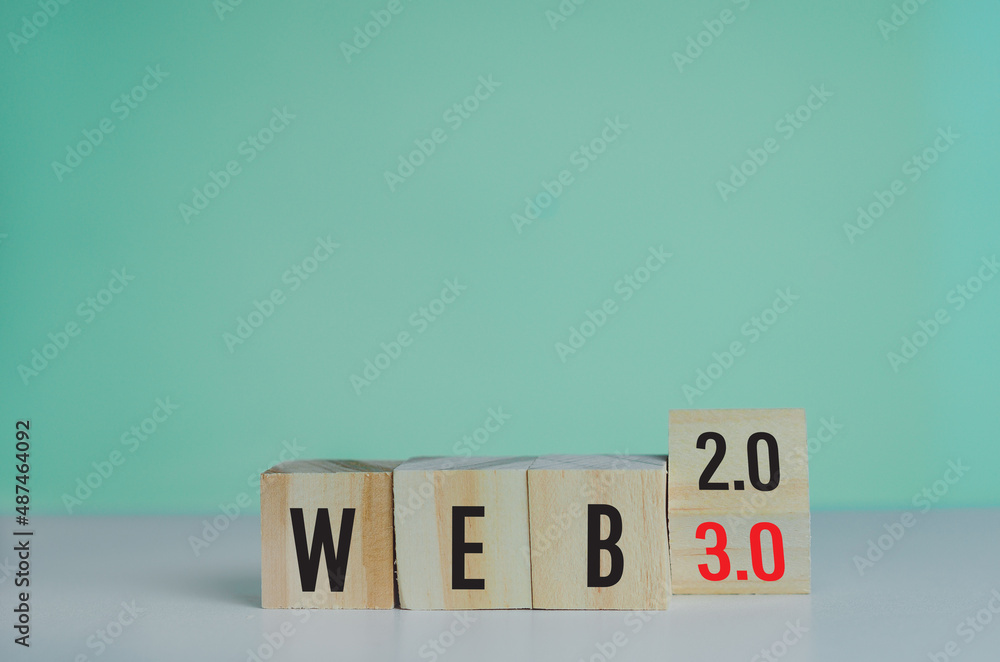 Poster wooden cubes with web 3.0 symbol on background and copy space.business concepts.