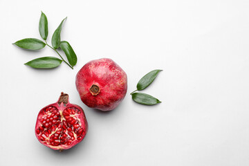 Ripe delicious pomegranate on light background