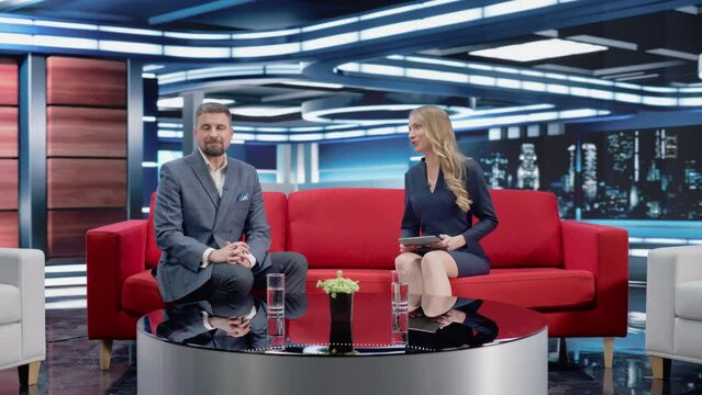 Talk Show TV Program: Two Professional Presenters Talk, Discuss News, Politics, Science, Gossip, Celebrity and Entertainment. Cable Channel Hosts Have Conversation. Playback Mock-up Television Studio