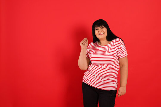 Beautiful Overweight Mature Woman On Red Background. Space For Text