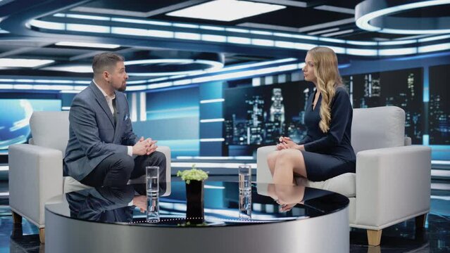 Talk Show TV Program: Two Professional Presenters Talk, Discuss News, Politics, Science, Gossip, Celebrity and Entertainment. Cable Channel Hosts Have Conversation. Playback Mock-up Television Studio