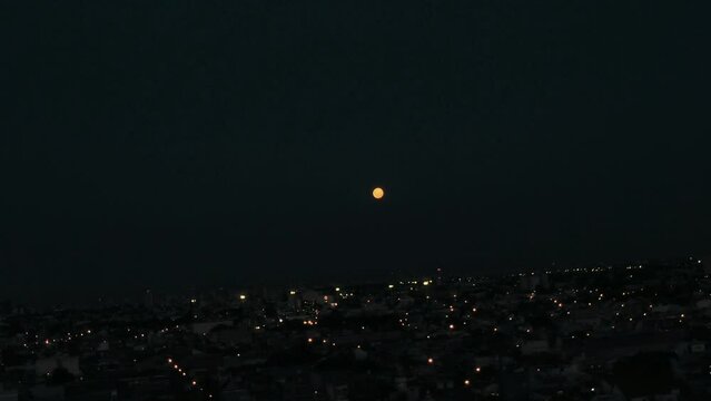 City ​​under the night of the full moon Fly Drone 4k aerial <> Argentina Buenos Aires La Matanza