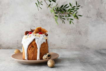 Plate with delicious Easter cake and eggs on table