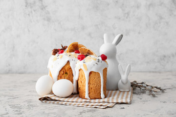 Delicious Easter cakes, eggs and pussy willow branches on light background
