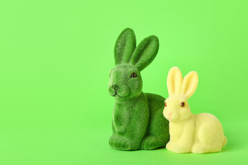 Beautiful Easter bunnies on green background