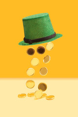 Minimal abstract magic treasure concept. Green glitter top hat with golden coins falling out of it....