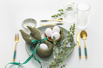Stylish Easter table setting on white background